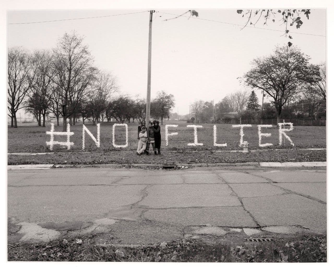 A Message in Nestle Water Bottles from Shea Cobb, Amber Hasan, Macana Roxie and LaToya Ruby Frazier at Sussex Drive and West Pierson Road, Flint, MI