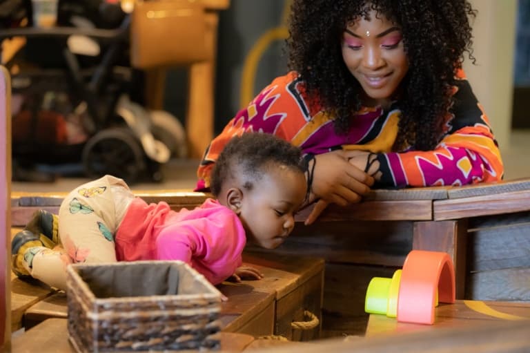 A mother and child play together in the Crocker Art Museum.