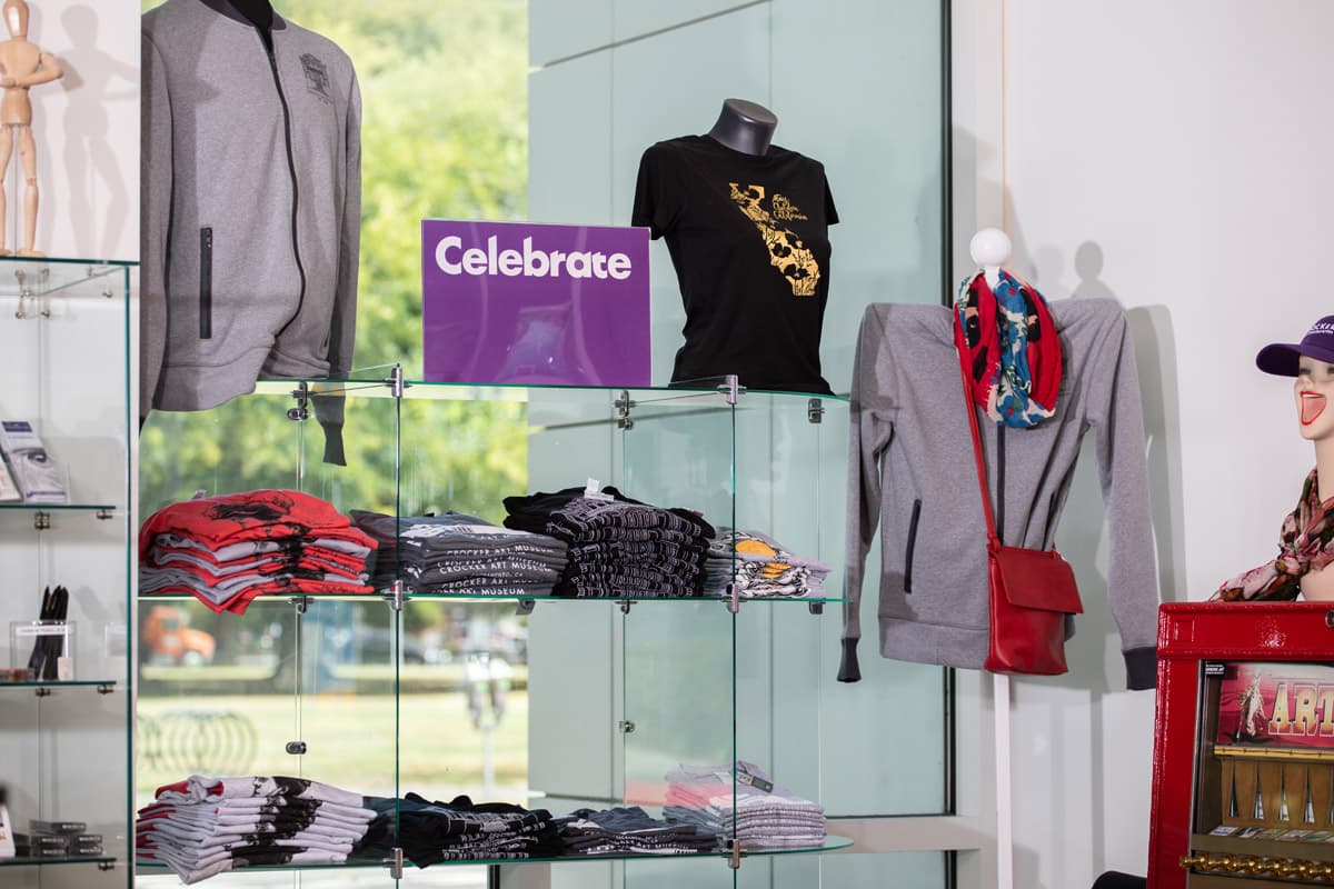 A window display of t-shirts and scarves in the Museum store.